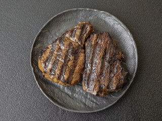 Grilled beef steak with salt, spices and herbs