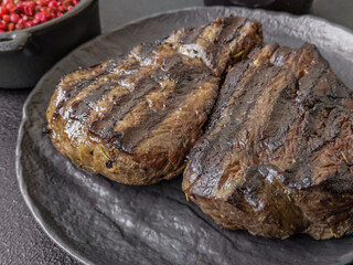 Grilled beef steak with salt, spices and herbs