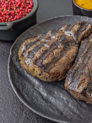 Grilled beef steak with salt, spices and herbs