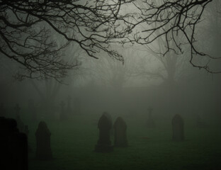 Eerie Graveard in thick fog and mist