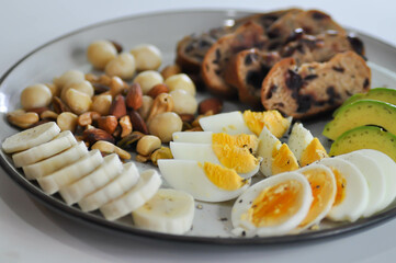 walnut cranberry sourdough bread or cranberry sourdough with boiled egg , avocado , banana and nuts