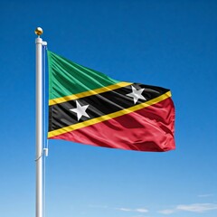 Fototapeta premium national flag of Saint Kitts, waving against blue sky, flag of the nation, blowing in the wind