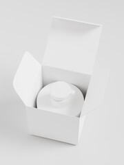 top view of Pump bottle in a open paper box, cylindrical liquid dispenser bottle and box packaging, plastic body wash container, liquid contributor, soap and hair product bottle, clean beauty concept