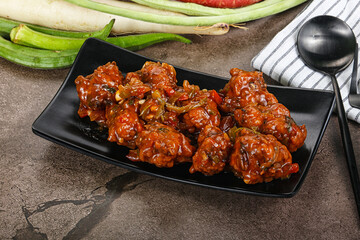 Manchurian chicken with sauce and spices