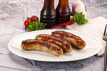 Delicous natural roasted sausages in the plate