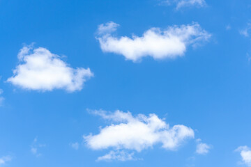 Low angle view of beautiful blue sky with strange shape of fluffy white clouds in the morning or evening in sunny day used as natural background texture in decorative art work