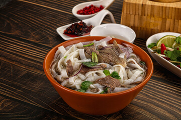 Vietnamese Pho Bo soup with beef and noodles