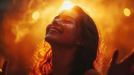 Woman expresses pure joy with tears streaming during celebration in sunset glow