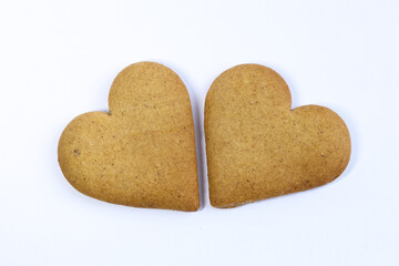 Two heart-shaped cookies on a white background. Isolated.