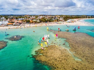 Porto de Galinhas - aerial view of the natural pools of Porto de Galinhas at low tide full of rafts