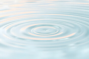 Close-up of gentle ripples on a calm water surface, creating a soothing and serene pattern. Wellness, cosmetics, and eco-friendly advertising banners.