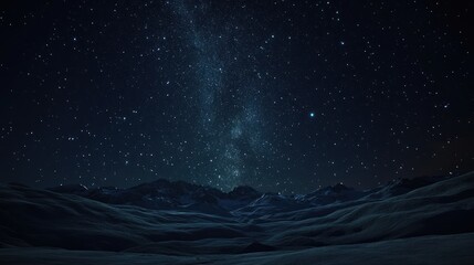 Naklejka premium Milky Way over dark mountain range at night.