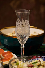A Beautiful and Elegant Table Setting Featuring Stunning Crystal Glassware and Delicious Appetizers