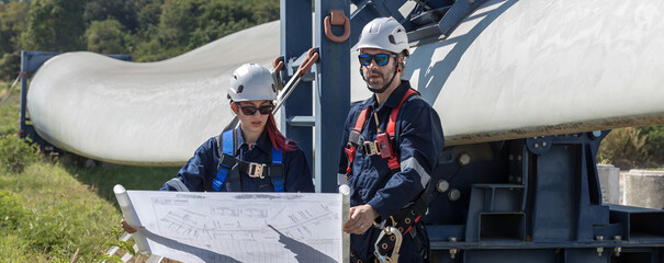 Inspection engineers a rotor blade of a wind turbine. Professional Man Maintenance engineers...