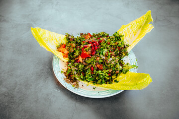 Fresh Tabbouleh Salad with Romaine Lettuce and Pomegranate Garnish