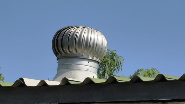 A metal vent on a house roof
