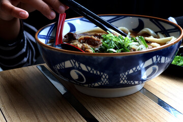 Udon photo, Udon is a typical Japanese noodle made from wheat flour, water, and salt. This noodle is known for its thick, chewy, and soft texture, making it one of the popular dishes in Japan