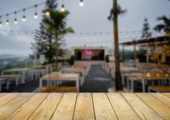 Wooden table top on blur  restaurant or cafe background.For montage product display or design key visual layout.View of copy space.