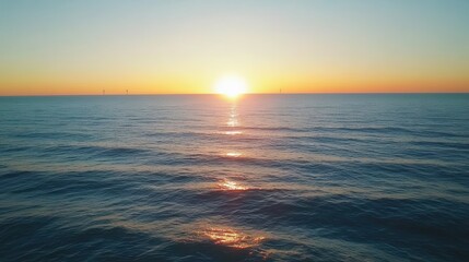 Fototapeta premium Panoramic Ocean Sunset with Wind Turbines