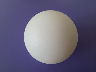 white ball on purple