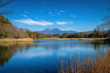 A beautiful photograph of Mount Fuji with its reflection on the lake, a blue sky, and a minimalist style. The image is high resolution, high quality, and high in detail, with a sharp focus and no blur