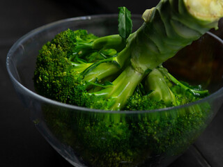 Broccoli in a transparent bowl