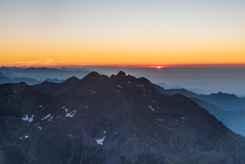 Sunrise from Roccciamelone mountain peak in Graian Alps in Italy