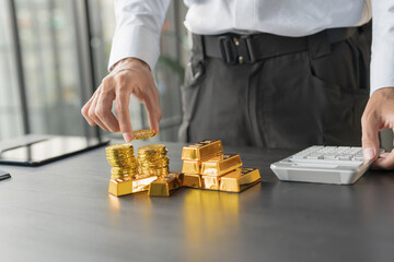 Gold Trading business man hand offering gold&nbsp;Investment in gold mining company or Trading gold on the stock exchange&nbsp;Rising gold prices.
