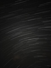 Long Exposure Star Trails Over Night Sky.