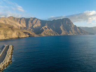 Obraz premium Aerial view of West coast of Gran Canaria, Spain. Mountains overlooking the sea, rugged coastline and Atlantic Ocean. Puerto de las Nieves. Canary islands
