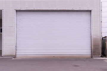 A closeup shot of automatic metal roller door used in factory, storage, garage, and industrial...