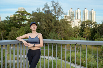 Young Woman Enjoying a Sunny Day While Exercising Outdoors in an Urban Park Setting