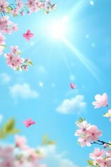 Spring blossoms against a blue sky with shiny sunbeam background