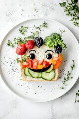 a sandwich with fruits and vegetables made a funny face, on a white plate