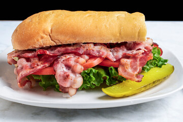 blt sub  sandwich with a pickle