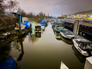 Prague, Czech republic - January 08, 2024. Boat moored in safety port of Smichov and Cisarska louka...
