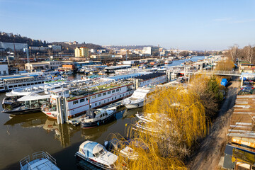 Prague, Czech republic - January 08, 2024. Boat moored in safety port of Smichov and Cisarska louka...