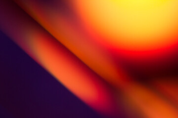 Colorful light leak on black background, abstract with optical lens flare shot on a true photo lens.