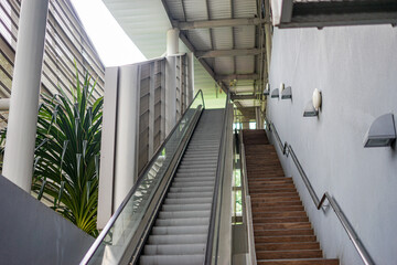 Escalator next to stairs