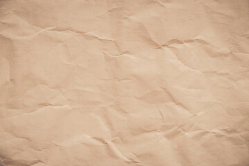 close-up of crumpled brown paper, revealing a texture reminiscent of aged parchment