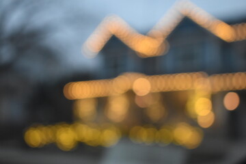 A dreamy view of a typical home lit by golden lights.