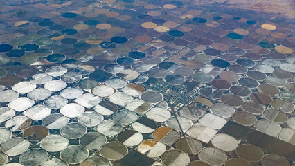Aerial view of the town of Center, Colorado, USA, amid circular irrigated fields in the winter