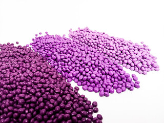 masterbatch, masterbatch granules form purple pigment, virgin polymer resin pigment isolated with white background, suitable for plastic industry product catalog design
