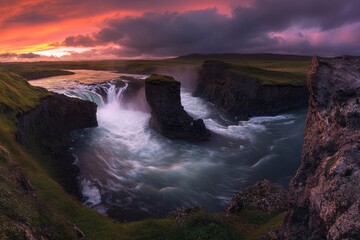 wide angle view of godafoss waterfall with lush green landscape and river at sunset, vibrant colors, cinematic