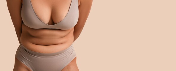 Young African-American woman in underwear on beige background with space for text, closeup. Concept of body positivity