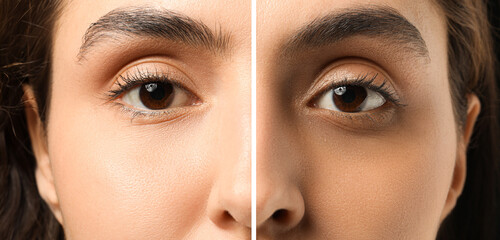 Young woman with brown eyes on dark background, closeup