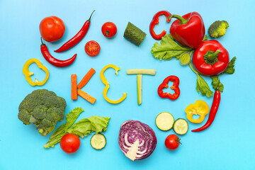 Composition with word KETO and different fresh vegetables on color background