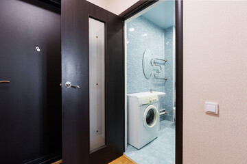 modern bathroom room with toilet and washing machine