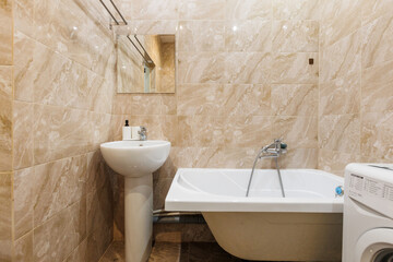 modern bathroom room with toilet and washing machine