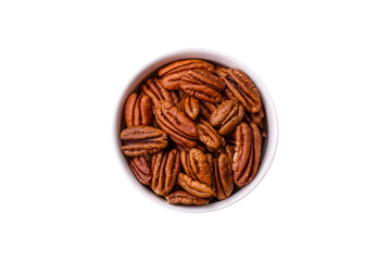 Delicious nutritious pecan nuts in ceramic bowl